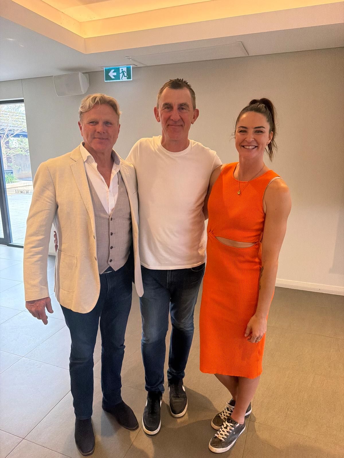 4QTR hosts with a special guest at an event