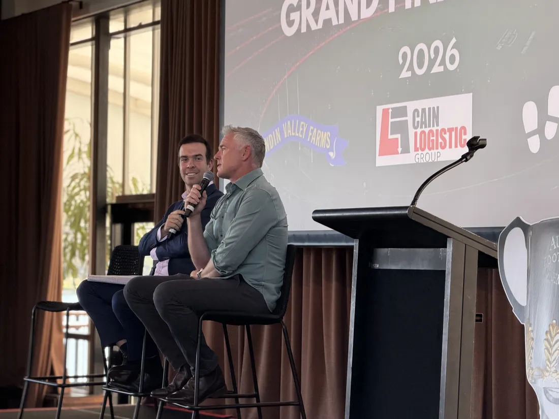 Two speakers in conversation on stage