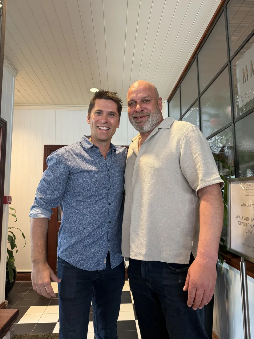 Two guests posing together at the Brisbane event