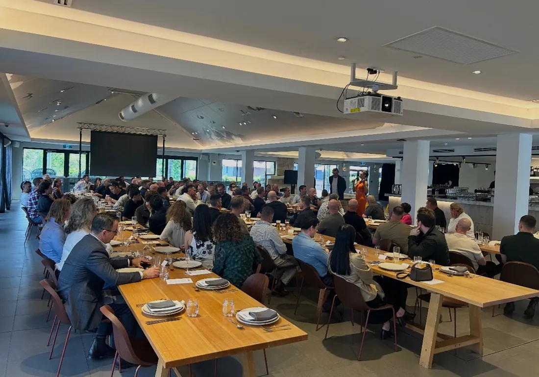 Guests seated at long tables at the AFL Grand Final Week - Perth lunch